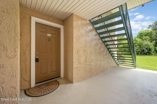 7667 N Wickham Rd Unit 903, Melbourne, FL 32940 - property entrance with stucco siding