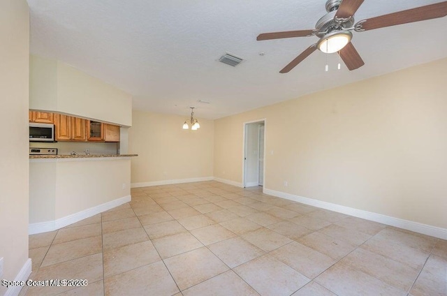 7667 N Wickham Rd Unit 903, Melbourne, FL 32940 - unfurnished living room with a chandelier, light tile patterned floors, and a ceiling fan