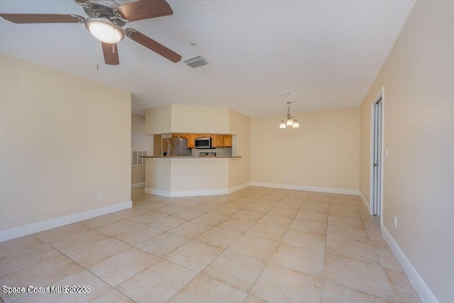 7667 N Wickham Rd Unit 903, Melbourne, FL 32940 - unfurnished living room featuring a chandelier, light tile patterned floors, and ceiling fan