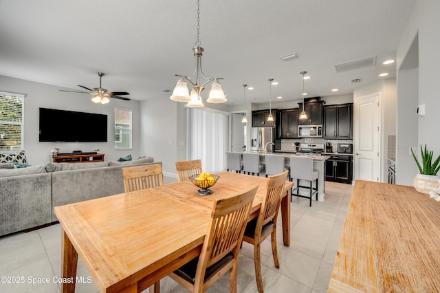 dining room featuring a ceiling fan, recessed lighting, light tile patterned floors, and visible vents