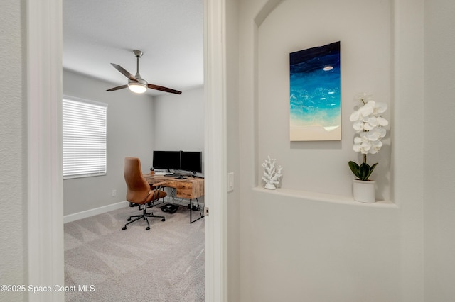 office with carpet flooring, ceiling fan, and baseboards