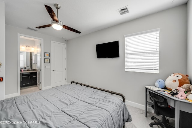 bedroom with visible vents, baseboards, ensuite bathroom, and ceiling fan