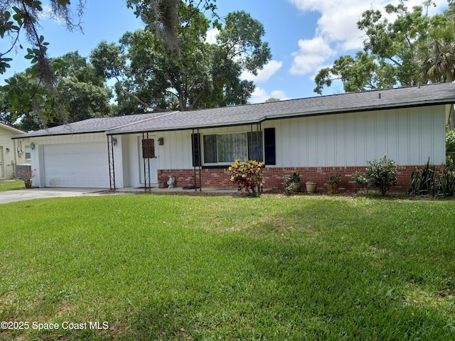single story home featuring brick siding, an attached garage, driveway, and a front yard