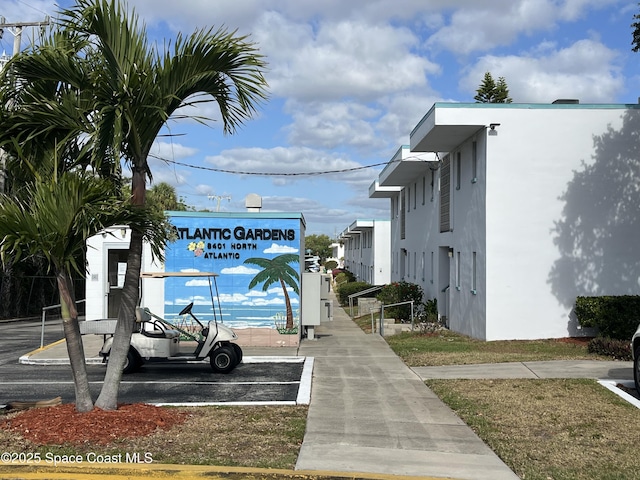 view of community featuring uncovered parking