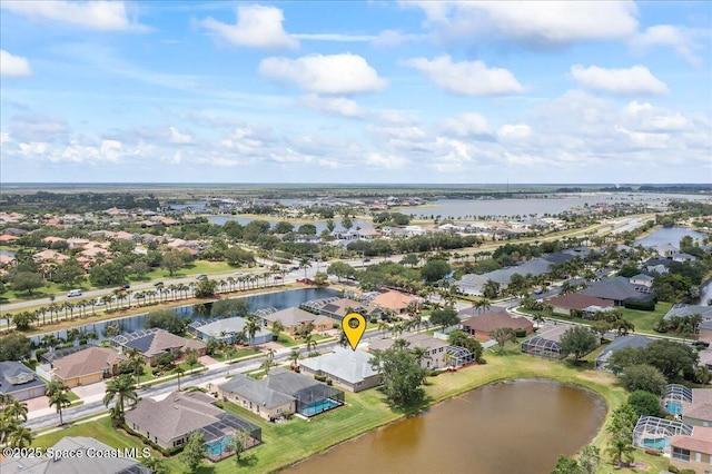 aerial view featuring a water view and a residential view