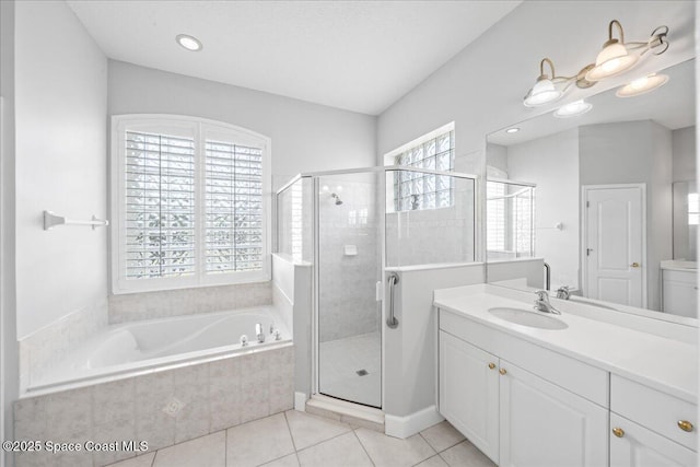 full bath featuring vanity, tile patterned floors, a stall shower, and a bath