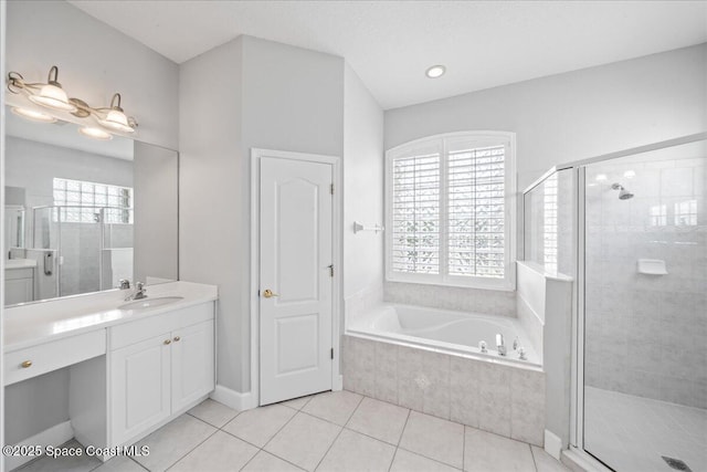 full bathroom with vanity, a bath, a stall shower, and tile patterned flooring