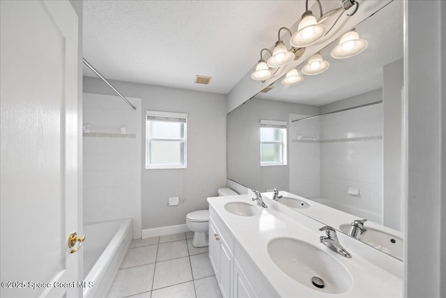 bathroom featuring a wealth of natural light and a sink
