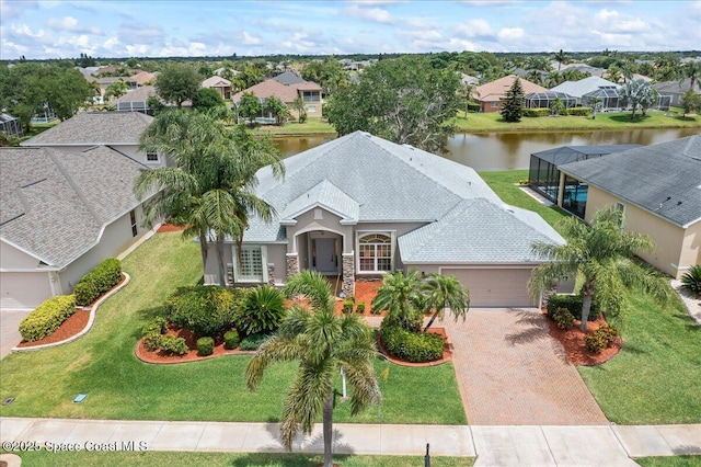 aerial view with a residential view and a water view