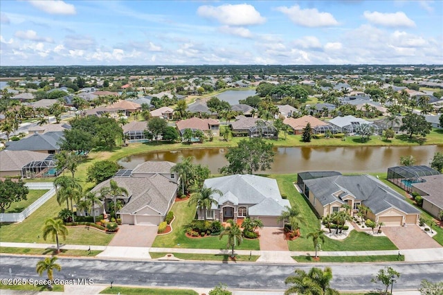 bird's eye view with a residential view and a water view