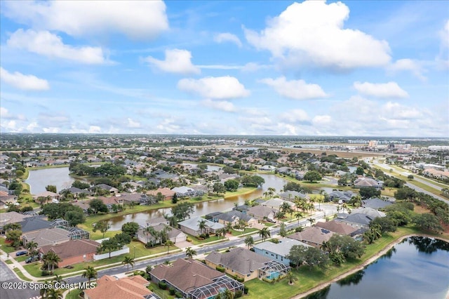aerial view featuring a water view and a residential view