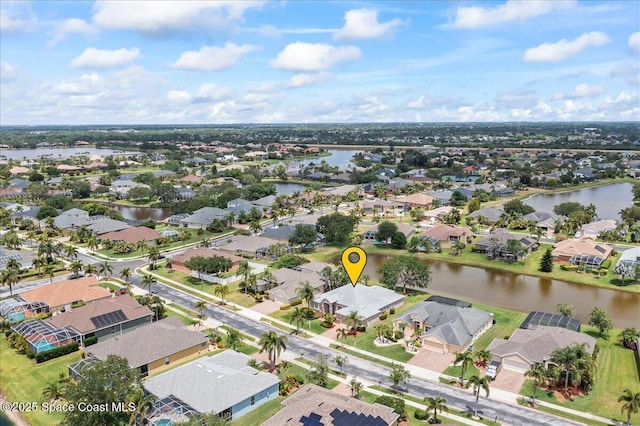 aerial view with a water view and a residential view