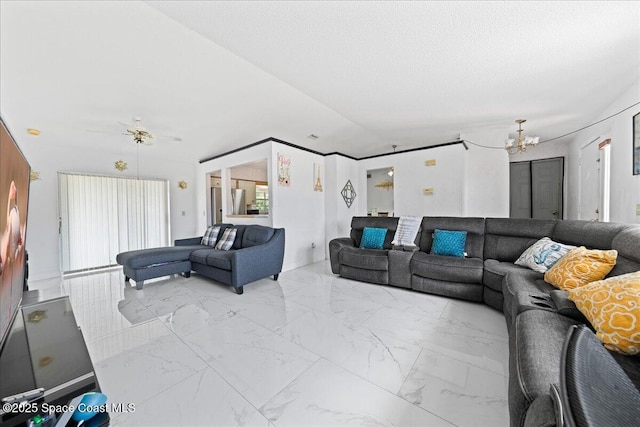 living room with an inviting chandelier, baseboards, and marble finish floor