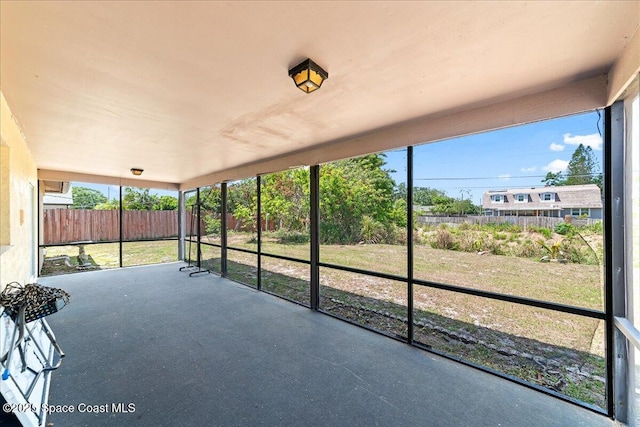 unfurnished sunroom featuring plenty of natural light