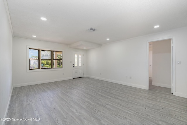 unfurnished living room with recessed lighting, baseboards, visible vents, and light wood-type flooring
