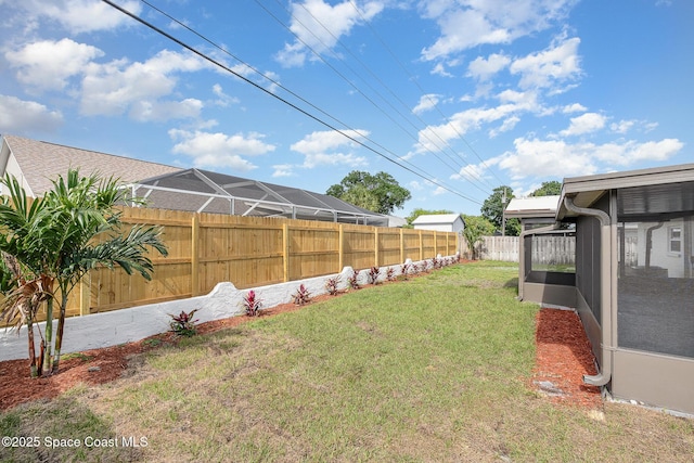 view of yard with a fenced backyard