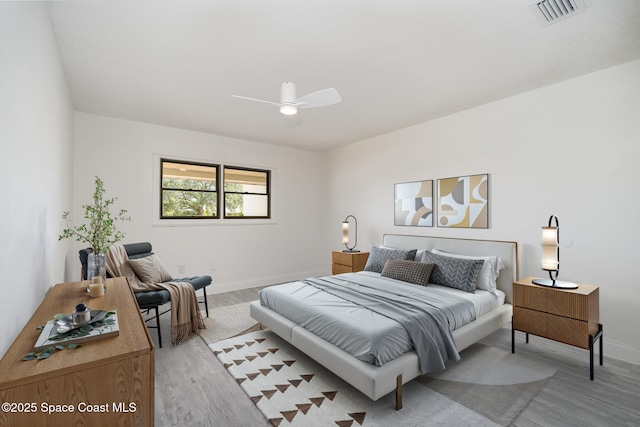 906 Kings Post Rd, Rockledge, FL 32955 - bedroom featuring light wood finished floors, baseboards, and ceiling fan