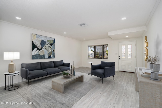 906 Kings Post Rd, Rockledge, FL 32955 - living area with light wood-style flooring, baseboards, recessed lighting, and crown molding