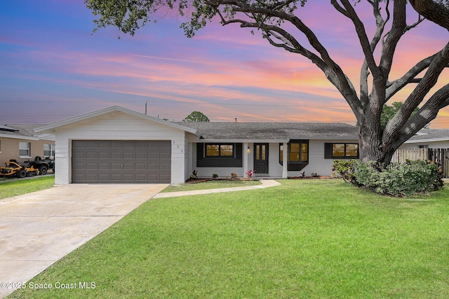 906 Kings Post Rd, Rockledge, FL 32955 - view of front of home featuring an attached garage, driveway, brick siding, and a shingled roof