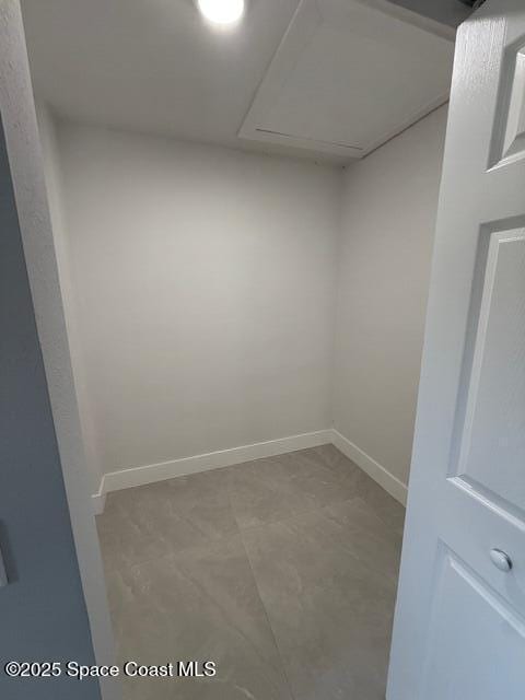 spare room featuring baseboards