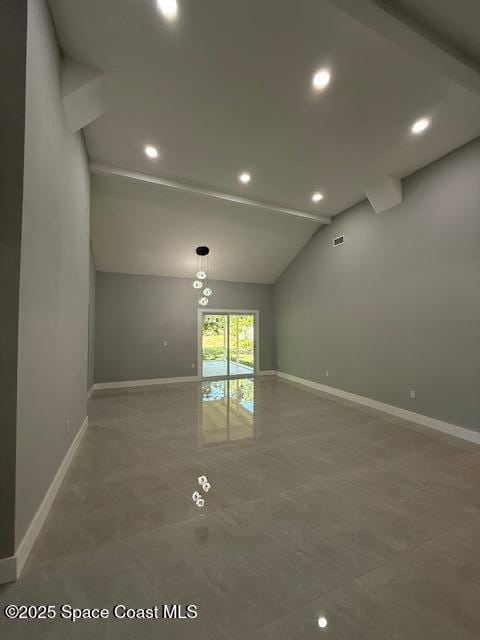 spare room featuring recessed lighting, baseboards, visible vents, and lofted ceiling