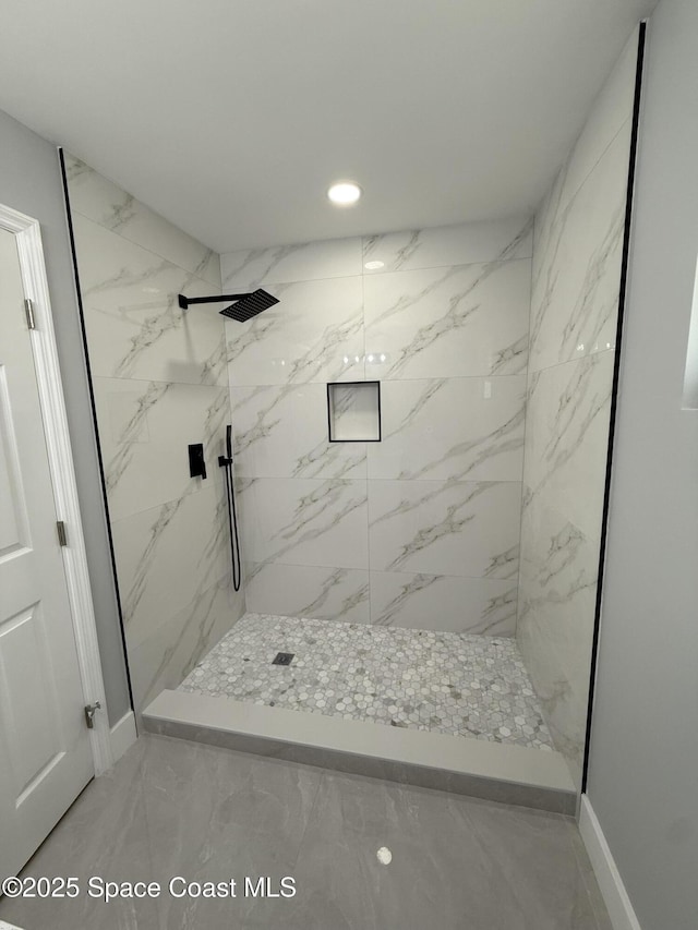 bathroom with a marble finish shower, baseboards, recessed lighting, and marble finish floor