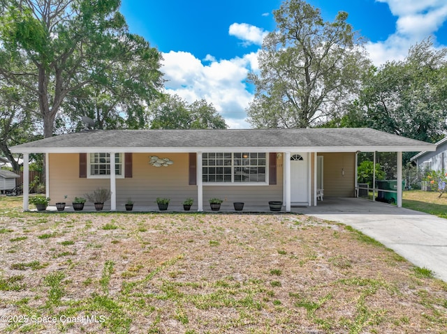 119 Landover Dr, Sebastian, FL 32958 - ranch-style house featuring concrete driveway, a front yard, and a carport