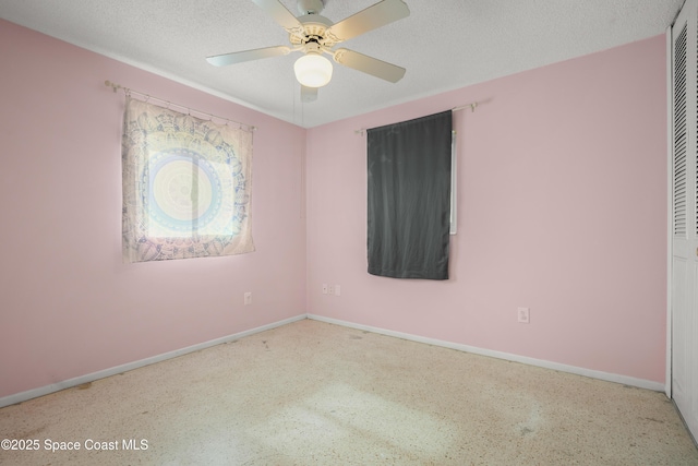 621 Plymouth St, Melbourne, FL 32935 - empty room with speckled floor, a textured ceiling, ceiling fan, and baseboards