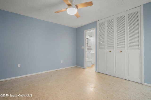 621 Plymouth St, Melbourne, FL 32935 - unfurnished bedroom featuring connected bathroom, a textured ceiling, baseboards, and a closet