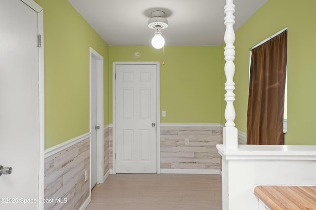 621 Plymouth St, Melbourne, FL 32935 - hall featuring a wainscoted wall and wood finished floors