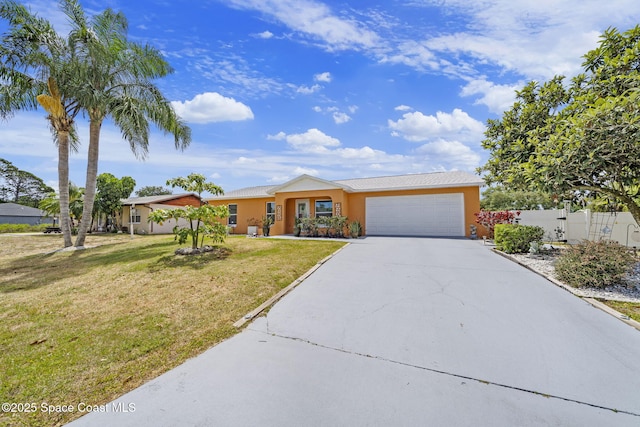 single story home featuring fence, a front lawn, a garage, stucco siding, and driveway