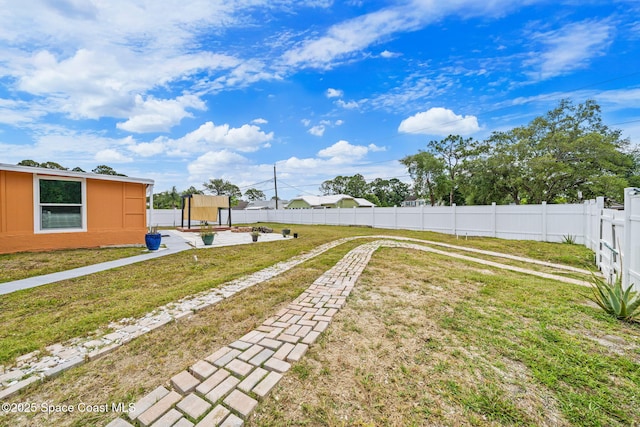 view of yard with a fenced backyard and a patio