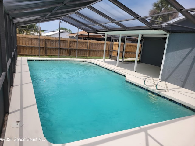 2175 Dumas St, Merritt Island, FL 32952 - view of pool featuring a patio area, fence, ceiling fan, and a lanai