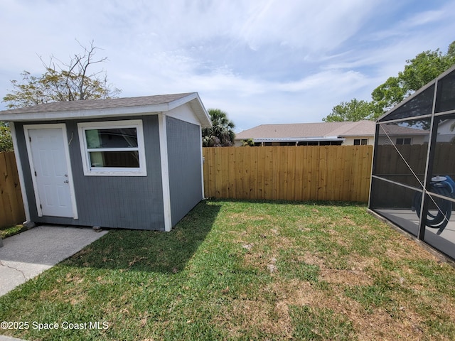2175 Dumas St, Merritt Island, FL 32952 - view of yard with an outbuilding, glass enclosure, and a storage shed