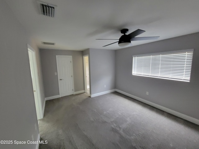 2175 Dumas St, Merritt Island, FL 32952 - carpeted spare room featuring a ceiling fan and baseboards