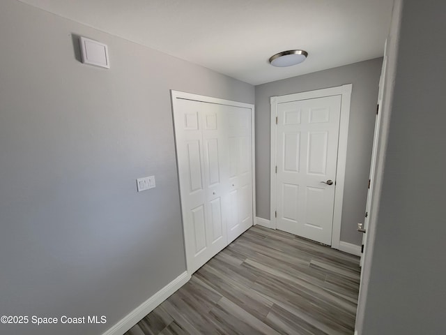 2175 Dumas St, Merritt Island, FL 32952 - unfurnished bedroom featuring baseboards, wood finished floors, and a closet