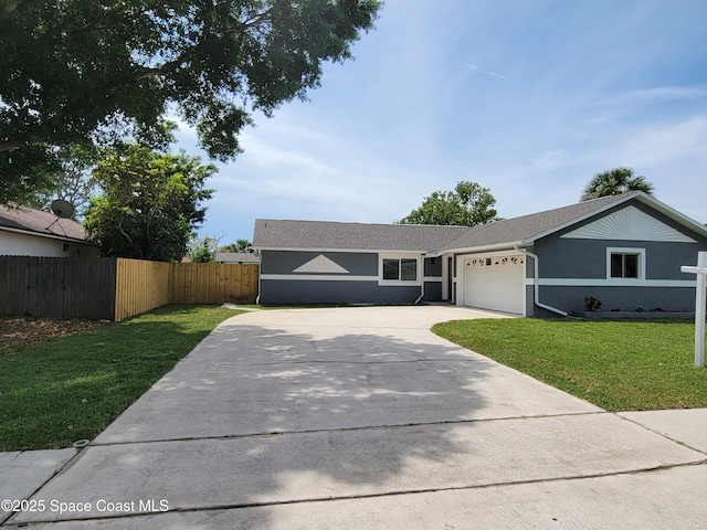 2175 Dumas St, Merritt Island, FL 32952 - ranch-style house with concrete driveway, an attached garage, and stucco siding