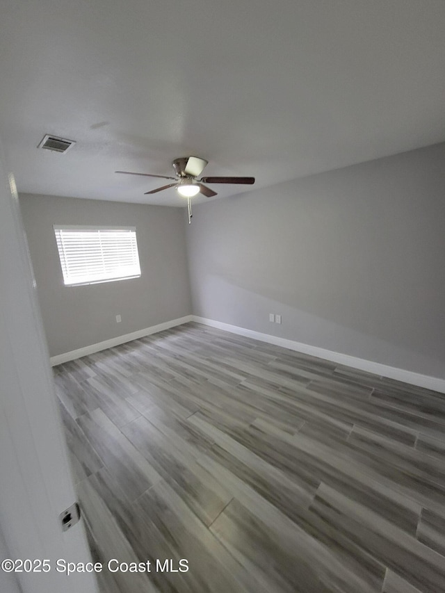 2175 Dumas St, Merritt Island, FL 32952 - unfurnished room featuring a ceiling fan, baseboards, and wood finished floors