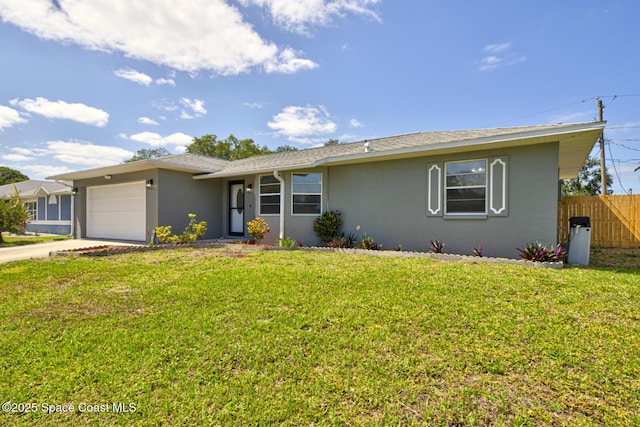 ranch-style house featuring an attached garage, fence, driveway, and a front yard