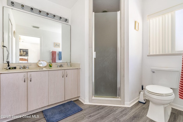 full bath featuring wood finished floors, visible vents, a sink, and a stall shower