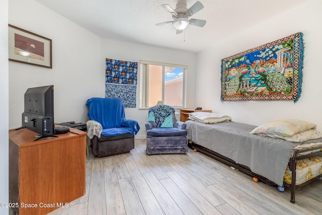 bedroom featuring light wood-style floors and a ceiling fan