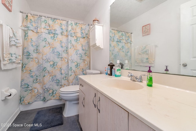bathroom with vanity, tile patterned flooring, toilet, baseboards, and a textured ceiling