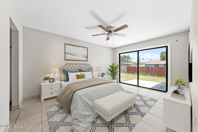 bedroom featuring light tile patterned floors, baseboards, a ceiling fan, and access to exterior