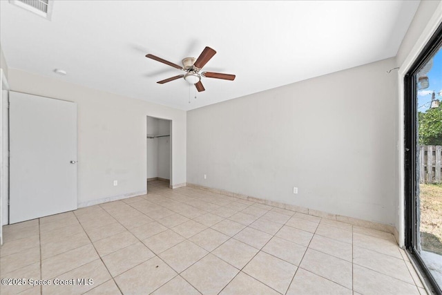 unfurnished bedroom with light tile patterned floors, access to outside, ceiling fan, and visible vents