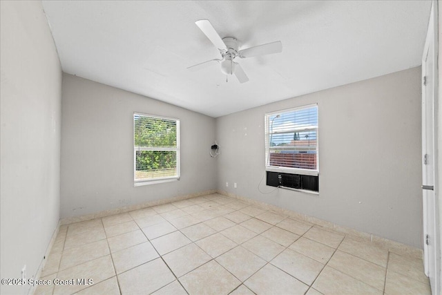 unfurnished room with vaulted ceiling, tile patterned flooring, cooling unit, and a ceiling fan
