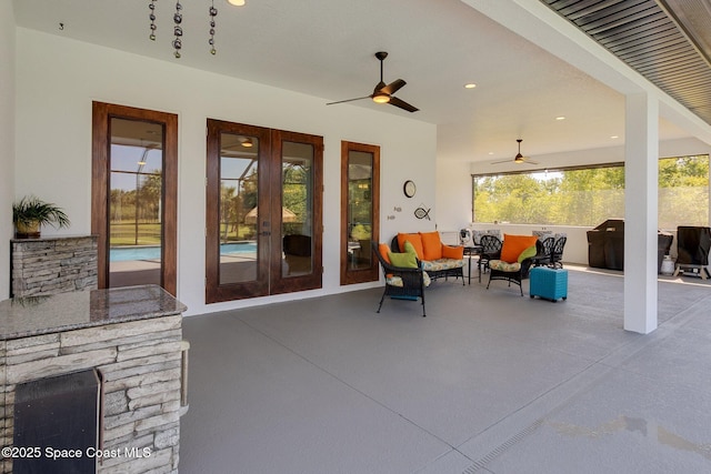 view of patio / terrace with ceiling fan, outdoor lounge area, and french doors