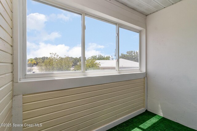 unfurnished sunroom featuring a healthy amount of sunlight