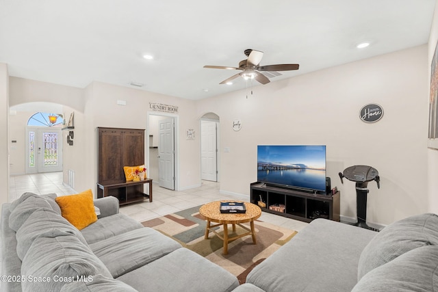 4637 Broomsedge Cir, West Melbourne, FL 32904 - living room featuring arched walkways, a ceiling fan, light tile patterned floors, baseboards, and recessed lighting