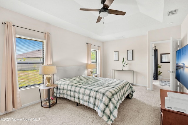 4637 Broomsedge Cir, West Melbourne, FL 32904 - carpeted bedroom with a raised ceiling, baseboards, and ceiling fan