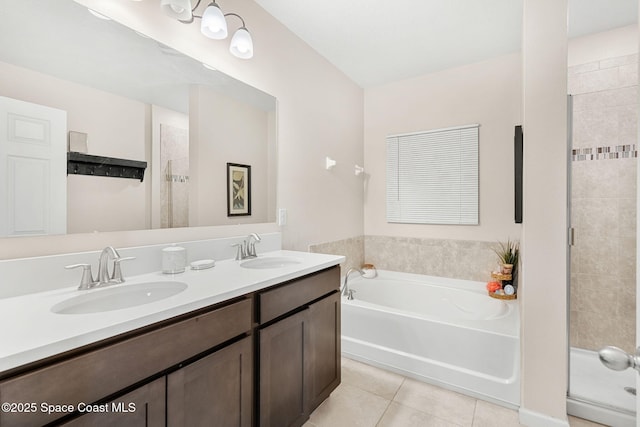4637 Broomsedge Cir, West Melbourne, FL 32904 - bathroom with tile patterned flooring, a stall shower, a bath, and double vanity